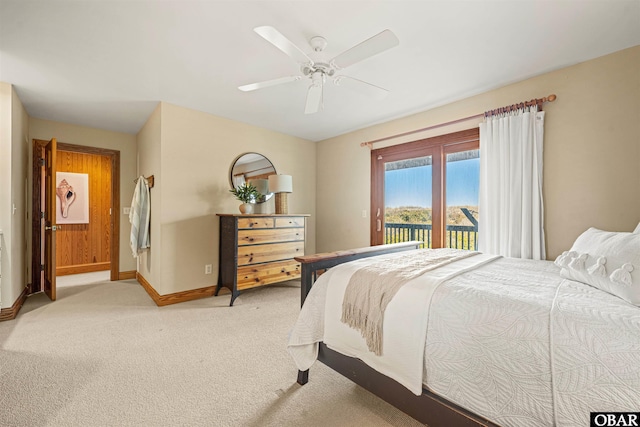 bedroom featuring access to exterior, baseboards, a ceiling fan, and light colored carpet