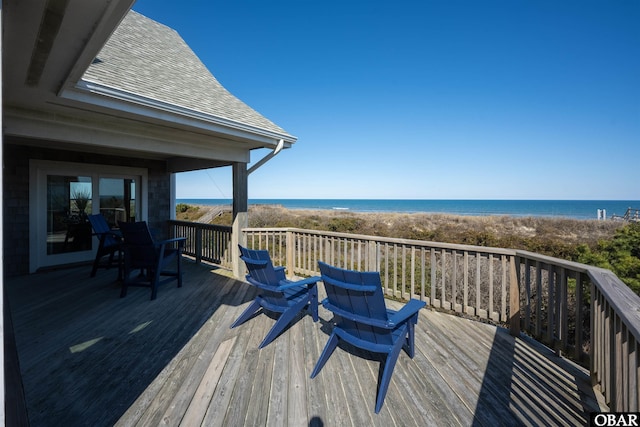 wooden deck featuring a water view