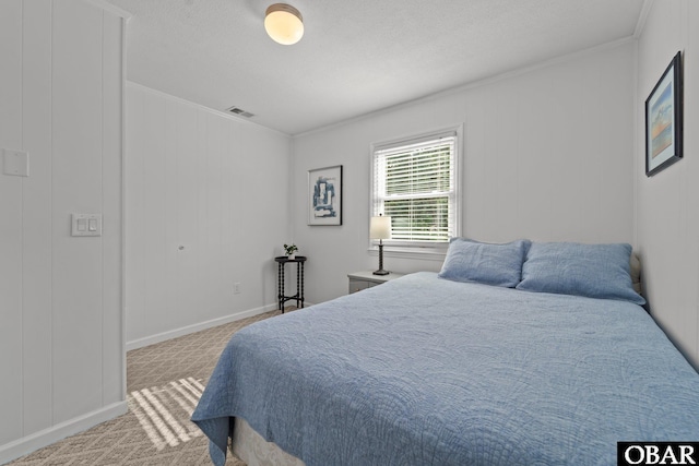 2908 S Meekins Ave Lot 9, Nags Head, NC 27959 - carpeted bedroom featuring crown molding and baseboards