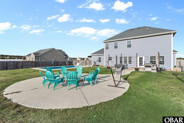 exterior space with a patio, a lawn, and a fenced backyard