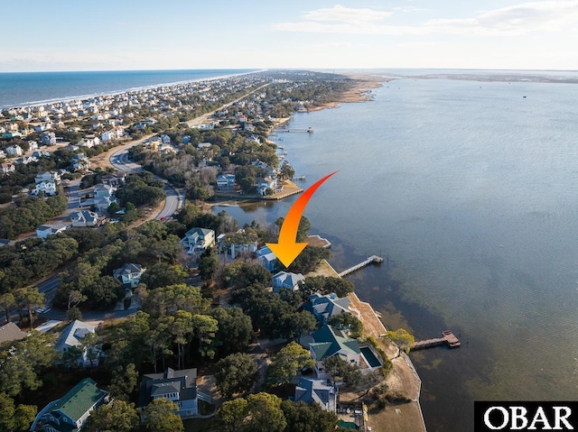 bird's eye view featuring a water view and a residential view