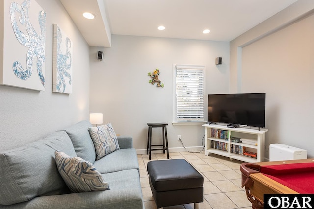 living room featuring light tile patterned floors, baseboards, and recessed lighting