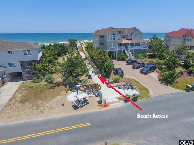 bird's eye view with a residential view and a water view