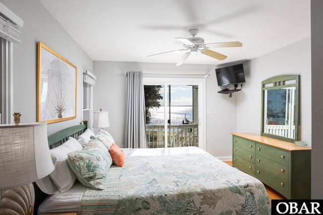 bedroom featuring a ceiling fan, access to outside, baseboards, and wood finished floors