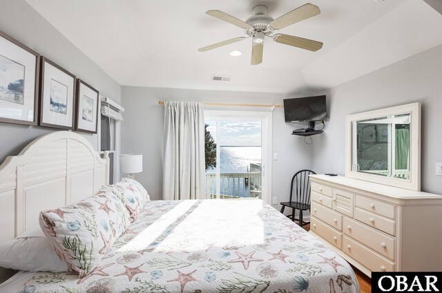 bedroom featuring access to outside, visible vents, and a ceiling fan