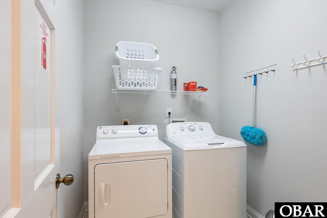 clothes washing area featuring laundry area and independent washer and dryer