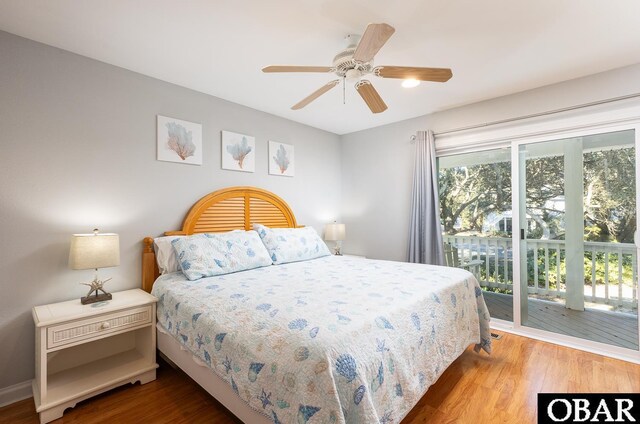 bedroom with wood finished floors, a ceiling fan, and access to exterior