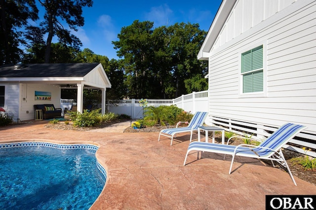 view of pool with a fenced in pool, a patio area, and a fenced backyard