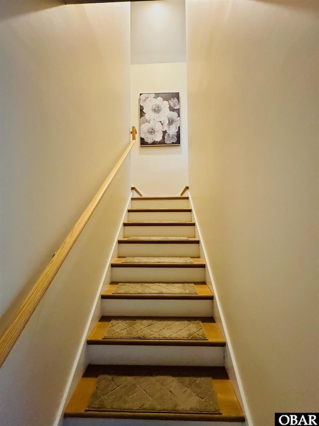 stairs featuring baseboards