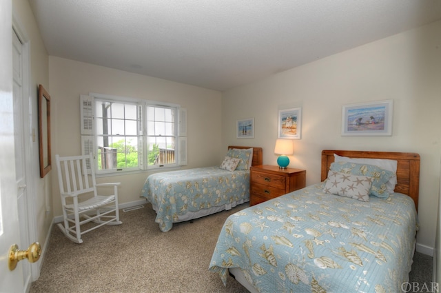 bedroom featuring baseboards and light colored carpet