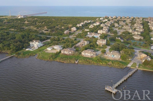 bird's eye view featuring a water view and a residential view