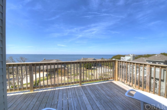 wooden deck featuring a water view