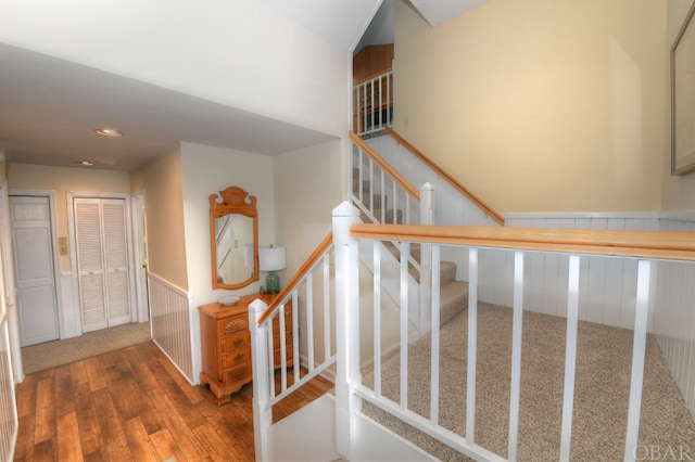 stairway with wood finished floors