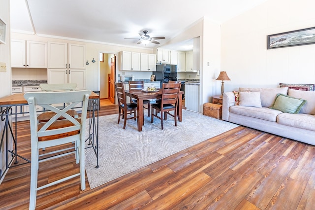 dining room with ceiling fan and wood finished floors