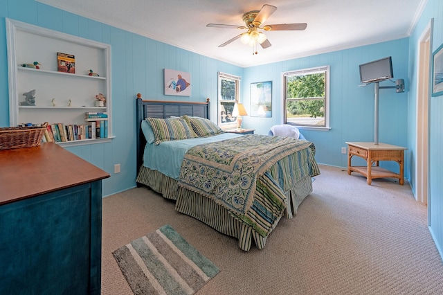 bedroom with ceiling fan, light colored carpet, and crown molding