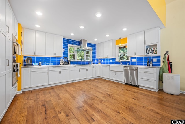 41 Eagles Nest Ln Lot 372, Southern Shores, NC 27949 - kitchen featuring stainless steel dishwasher, tasteful backsplash, island exhaust hood, light wood-type flooring, and recessed lighting