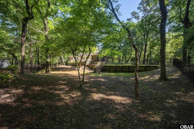 41 Eagles Nest Ln Lot 372, Southern Shores, NC 27949 - fenced backyard featuring stairs and a wooden deck