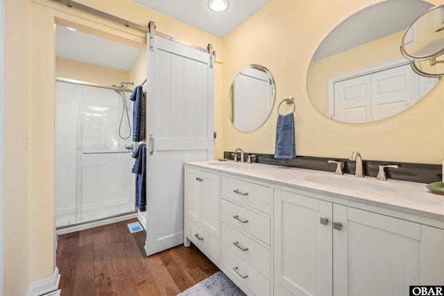 41 Eagles Nest Ln Lot 372, Southern Shores, NC 27949 - full bathroom with double vanity, a shower stall, wood finished floors, and recessed lighting