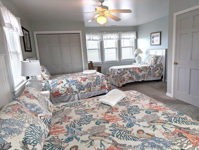 415 British Cemetery Rd Lot # 1 & 2, Ocracoke, NC 27960 - carpeted bedroom with multiple windows, a closet, ceiling fan, and baseboards