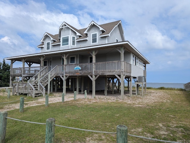 415 British Cemetery Rd Lot # 1 & 2, Ocracoke, NC 27960 - view of front of property with a front yard, covered porch, and a shingled roof