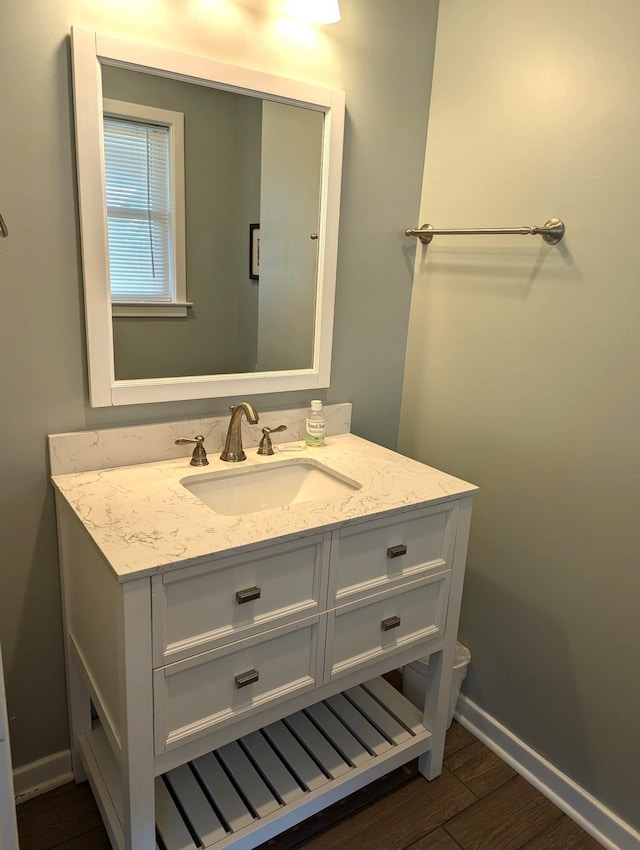 415 British Cemetery Rd Lot # 1 & 2, Ocracoke, NC 27960 - bathroom with vanity, wood finished floors, and baseboards
