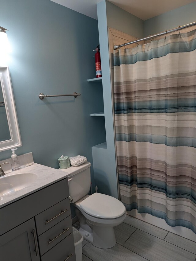 415 British Cemetery Rd Lot # 1 & 2, Ocracoke, NC 27960 - bathroom featuring vanity, toilet, and a shower with curtain
