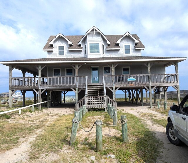 415 British Cemetery Rd Lot # 1 & 2, Ocracoke, NC 27960 - coastal inspired home with a carport, dirt driveway, roof with shingles, and a porch