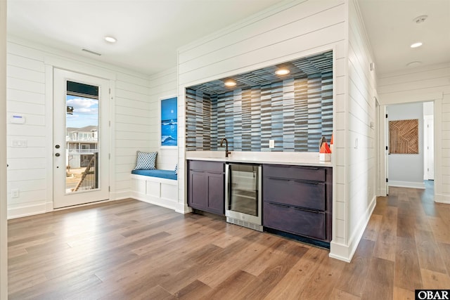 981 Lighthouse Dr Lot 10, Corolla, NC 27927 - indoor wet bar featuring wine cooler, wood finished floors, and wood walls