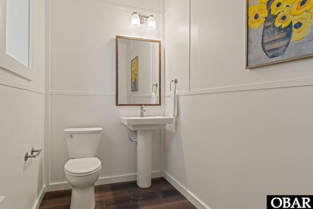 981 Lighthouse Dr Lot 10, Corolla, NC 27927 - half bathroom featuring toilet and wood finished floors