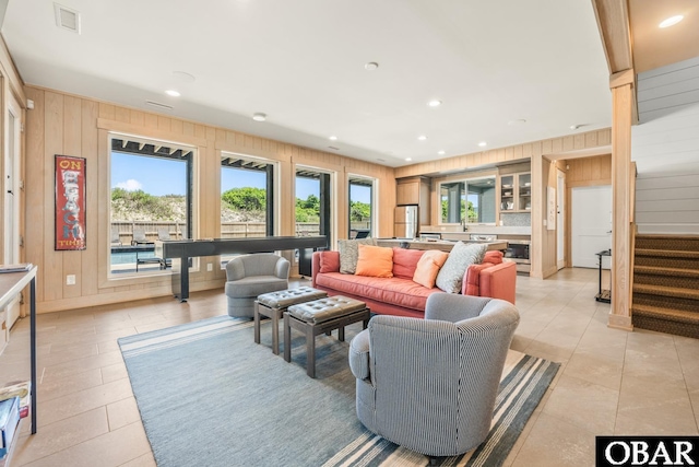 981 Lighthouse Dr Lot 10, Corolla, NC 27927 - living area with wood walls, light tile patterned floors, recessed lighting, and stairs