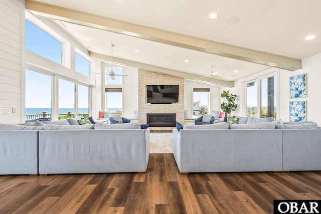 981 Lighthouse Dr Lot 10, Corolla, NC 27927 - living area featuring a fireplace, dark wood-style floors, healthy amount of natural light, and recessed lighting