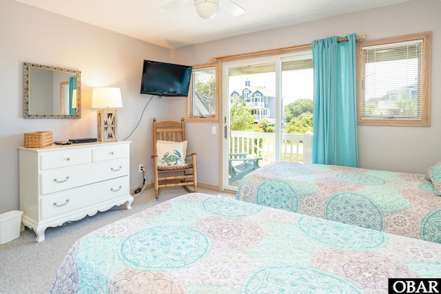 bedroom featuring baseboards, access to outside, carpet, and a ceiling fan