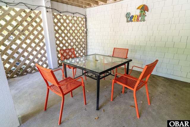 view of patio featuring outdoor dining area