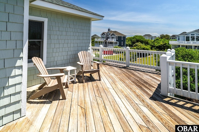 wooden terrace featuring a residential view