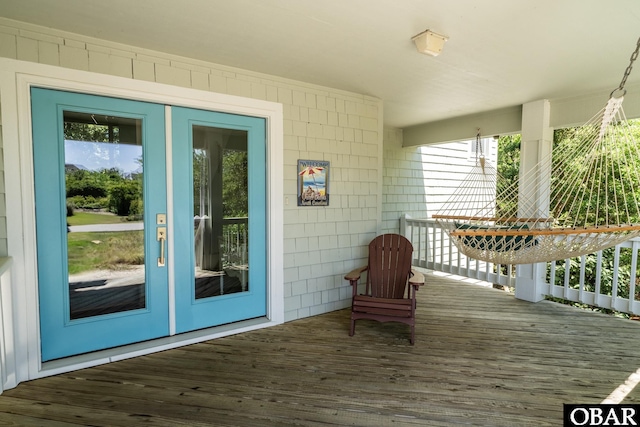 wooden deck featuring french doors