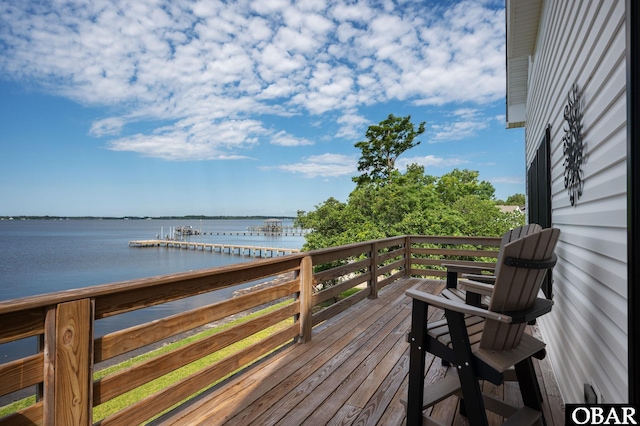 wooden deck with a water view