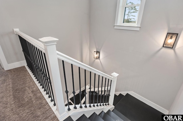 stairs with carpet floors and baseboards