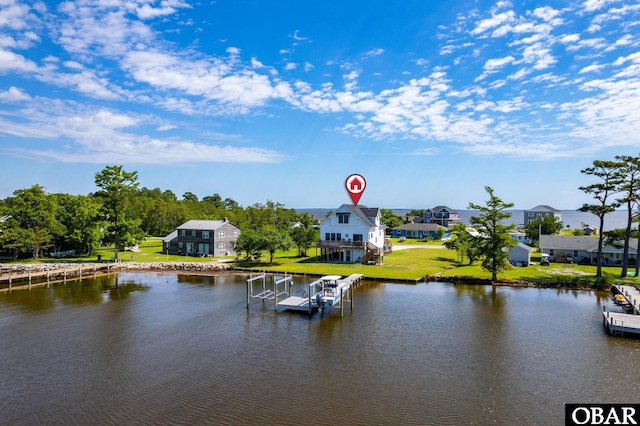 property view of water with a boat dock, boat lift, and a residential view