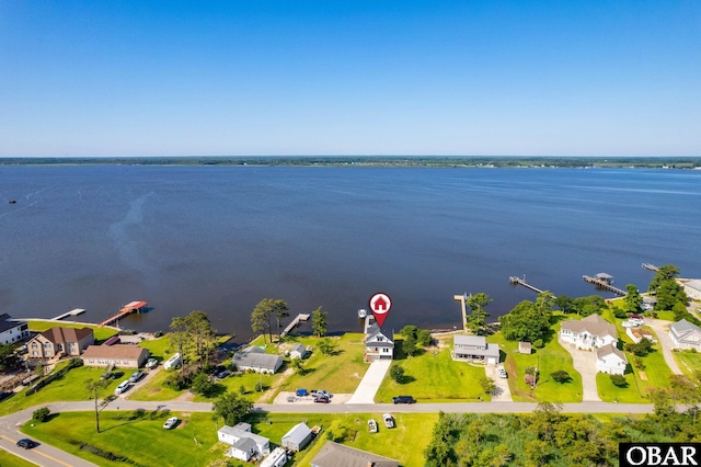 birds eye view of property featuring a residential view and a water view