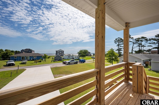 deck featuring a lawn