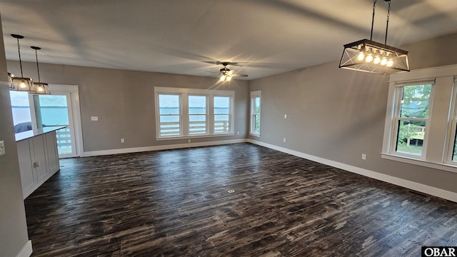 105 Baggy Davis Ln Lot 20B, Currituck, NC 27929 - unfurnished dining area featuring dark wood-type flooring, a chandelier, baseboards, and a ceiling fan