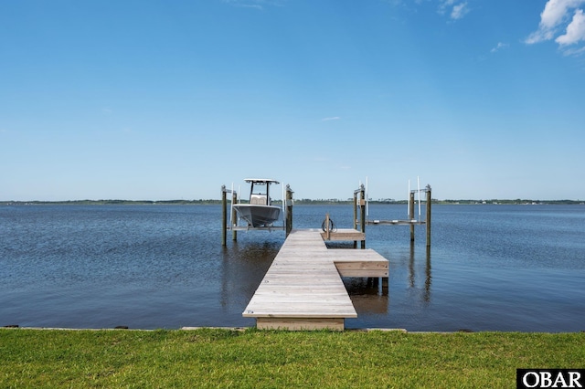 dock area with a water view and boat lift