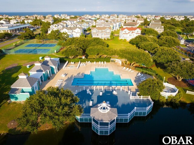 birds eye view of property with a residential view and a water view