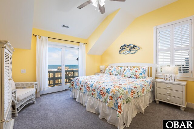 bedroom featuring a water view, visible vents, vaulted ceiling, access to outside, and dark carpet