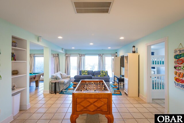 living room featuring light tile patterned floors, billiards, visible vents, and built in features