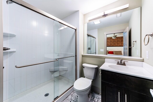 full bathroom with vanity, toilet, and a shower stall