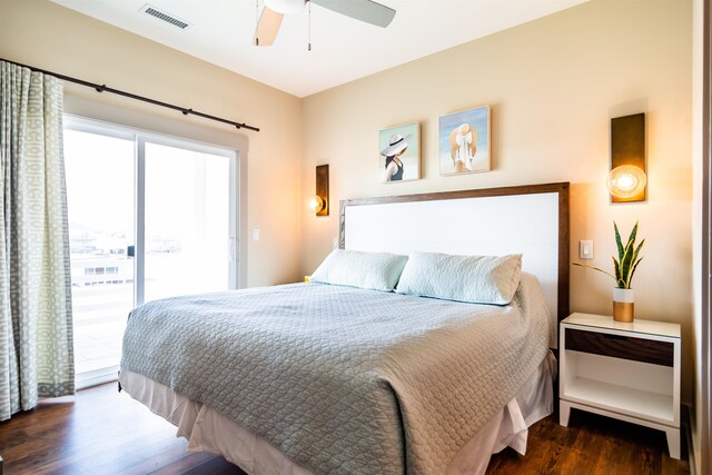 bedroom featuring a ceiling fan, access to outside, dark wood-style flooring, and visible vents