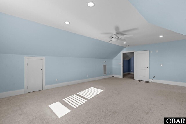 bonus room with lofted ceiling, recessed lighting, light colored carpet, a ceiling fan, and baseboards