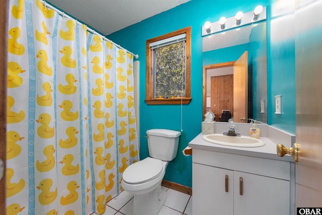 full bathroom with tile patterned floors, toilet, a textured ceiling, and vanity