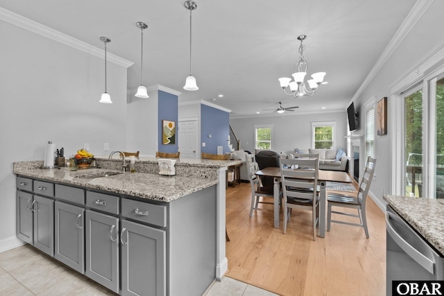 kitchen with a sink, gray cabinetry, dishwasher, a chandelier, and ornamental molding